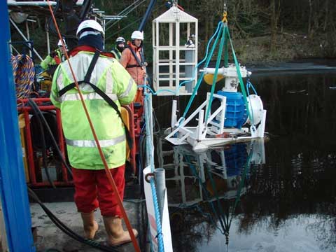 The Viking Johnson valve and trolley being lowered into the lake.